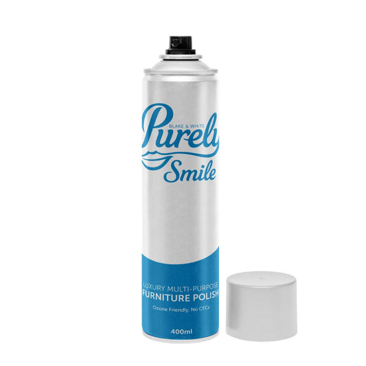 Spray bottle labeled 'Purely Smile' on a white background